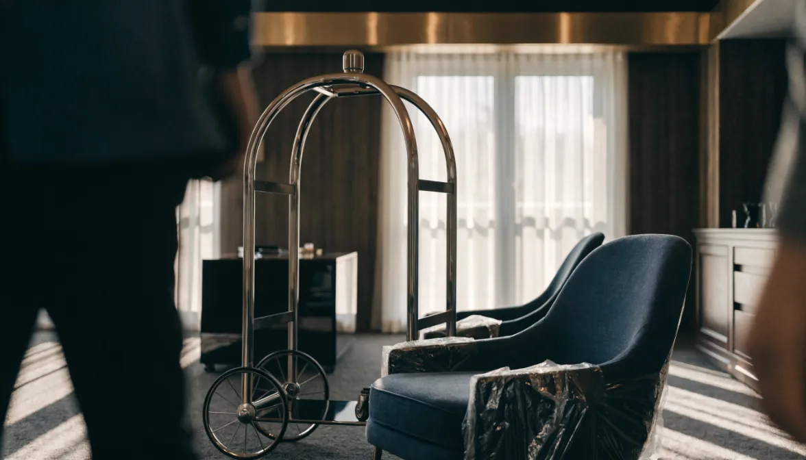 The hotel FF&E procurement process, step by step — luxury hotel lobby with concierge desk and FF&E