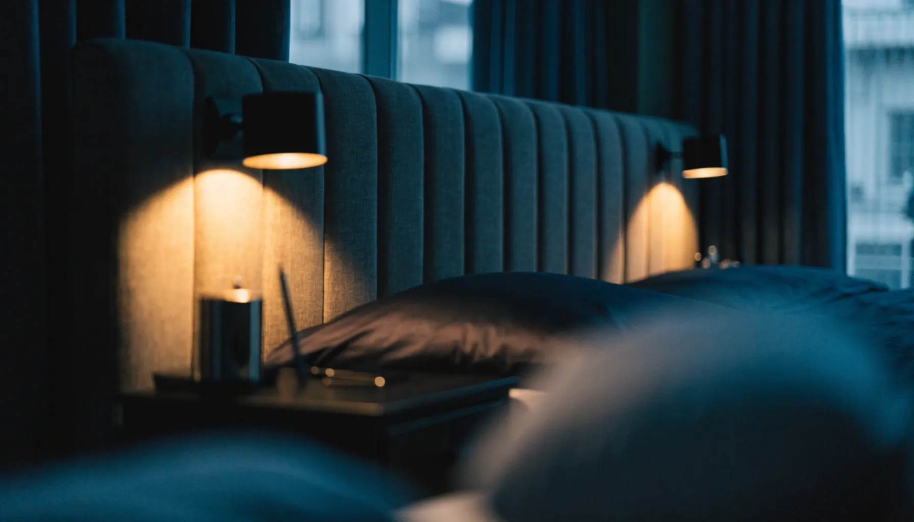 Hotel guest room lighting fit-out — bedside dimmer controls and warm color temperature, Stoch Hotel Consulting